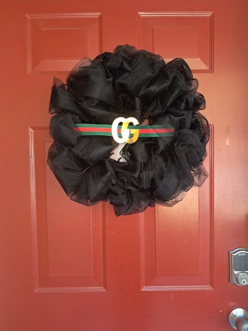 Black Decorative Tulle Wreath with Green-Red Ribbon Accent
